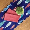 aqua-blue-red-fish-pattern-on-navy-quilted-reversible-table-runner-with-cloth-red-napkins
