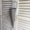 hanging-metal-vase-on-rustic-shutters