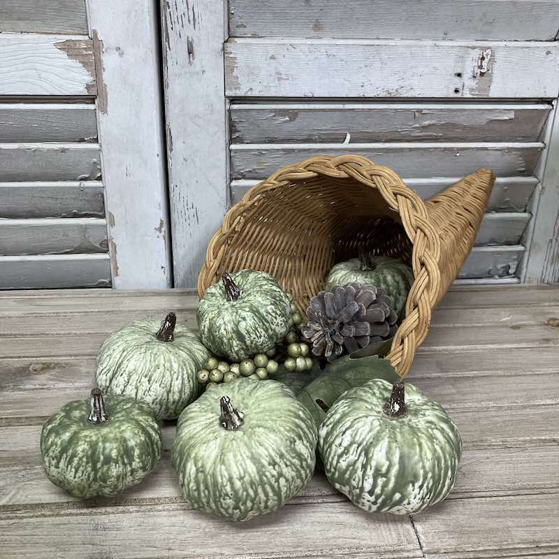 Harvest Mini Pumpkins Decorative Set displayed in a basket cornucopia