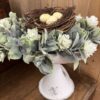 Twiggy Birds Nest with Eggs with Aylesford Creamy Flowers wiht Greenery Candle Ring on the Wimberly Cream Holder Twiggy Birds Nest with Eggs with Aylesford Creamy Flowers wiht Greenery Candle Ring on the Wimberly Cream Holder
