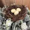 Twiggy Birds Nest with Eggs with Aylesford Creamy Flowers wiht Greenery Candle Ring Twiggy Birds Nest with Eggs with Aylesford Creamy Flowers wiht Greenery Candle Ring
