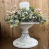 Aged Patina Cream Atessa Decorative Pedestal with Shallow Straights Pink Blooms and Greenery Candle Ring. Aged Patina Cream Atessa Decorative Pedestal with Shallow Straights Pink Blooms and Greenery Candle Ring.