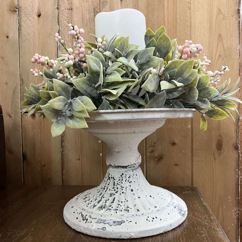 Aged Patina Cream Atessa Decorative Pedestal with Shallow Straights Pink Blooms and Greenery Candle Ring.