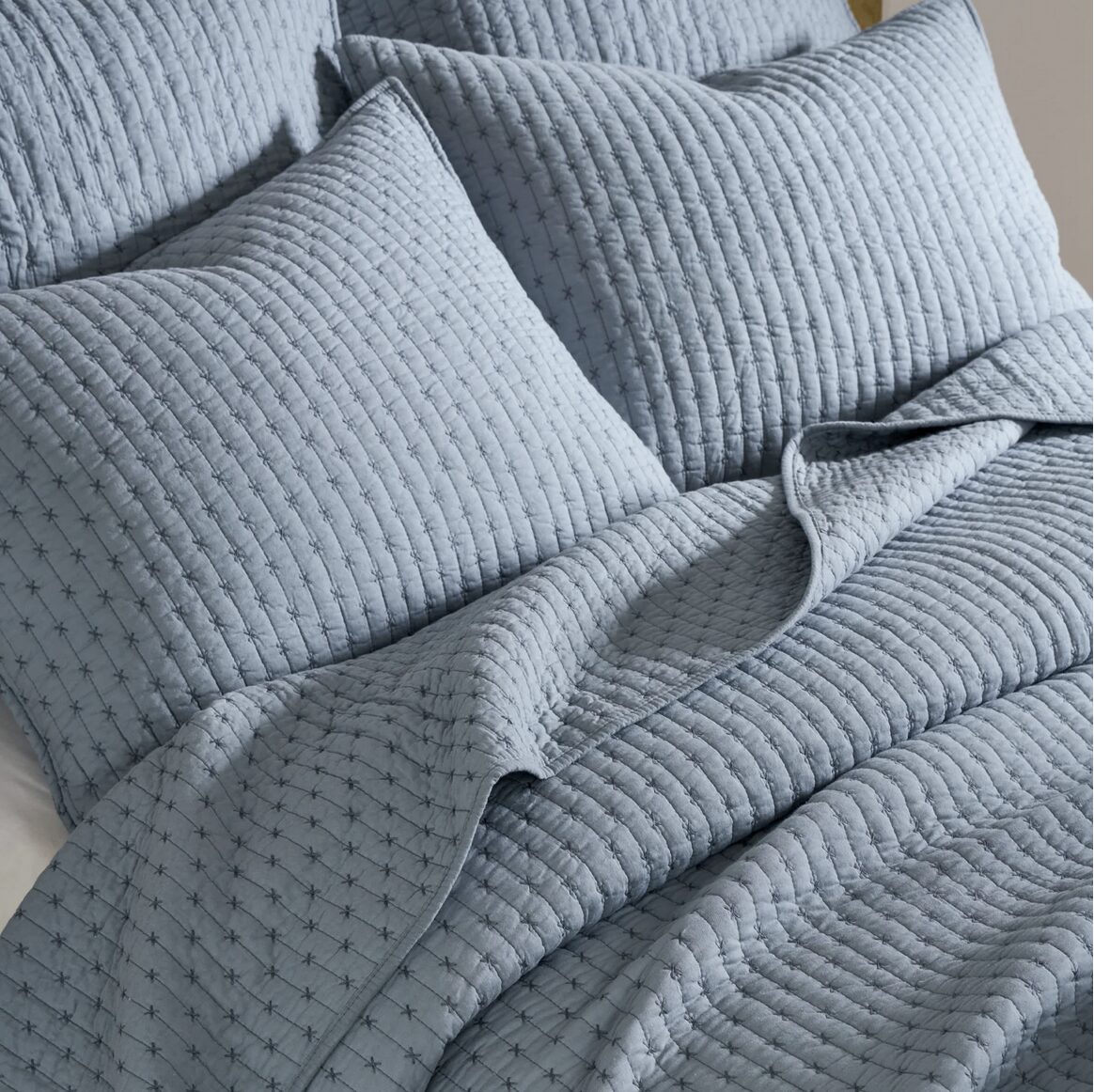 Cross Stitch Solid Chambray Blue Quilt Set includes a quilt and 2 shams