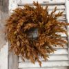 Sienna Hollow Faux Foliage Medium Wreath Hanging on Chippy Shutters